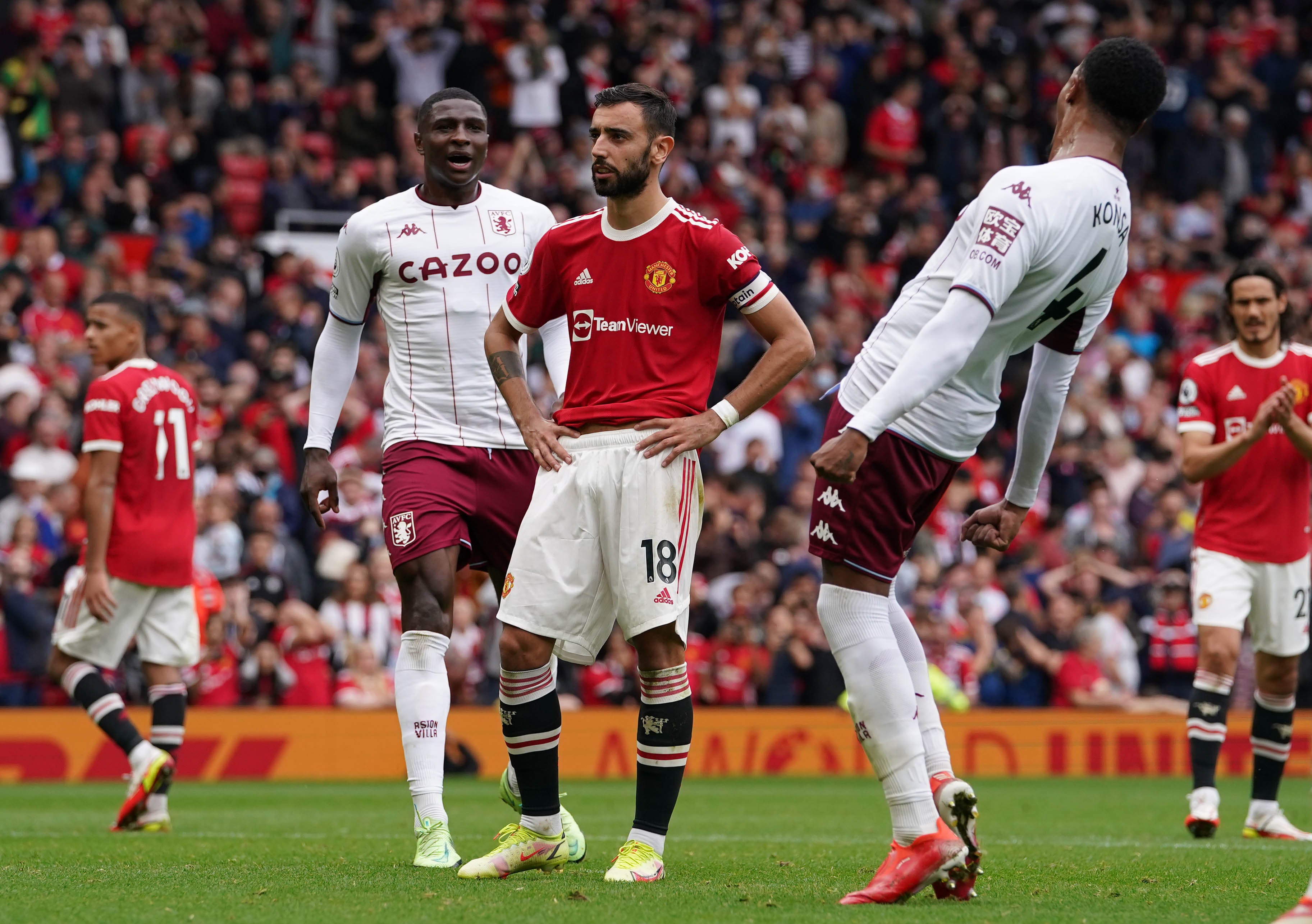 Manchester United’s Bruno Fernandes (centre) reacts to his missed penalty against Aston Villa (Martin Rickett/PA)