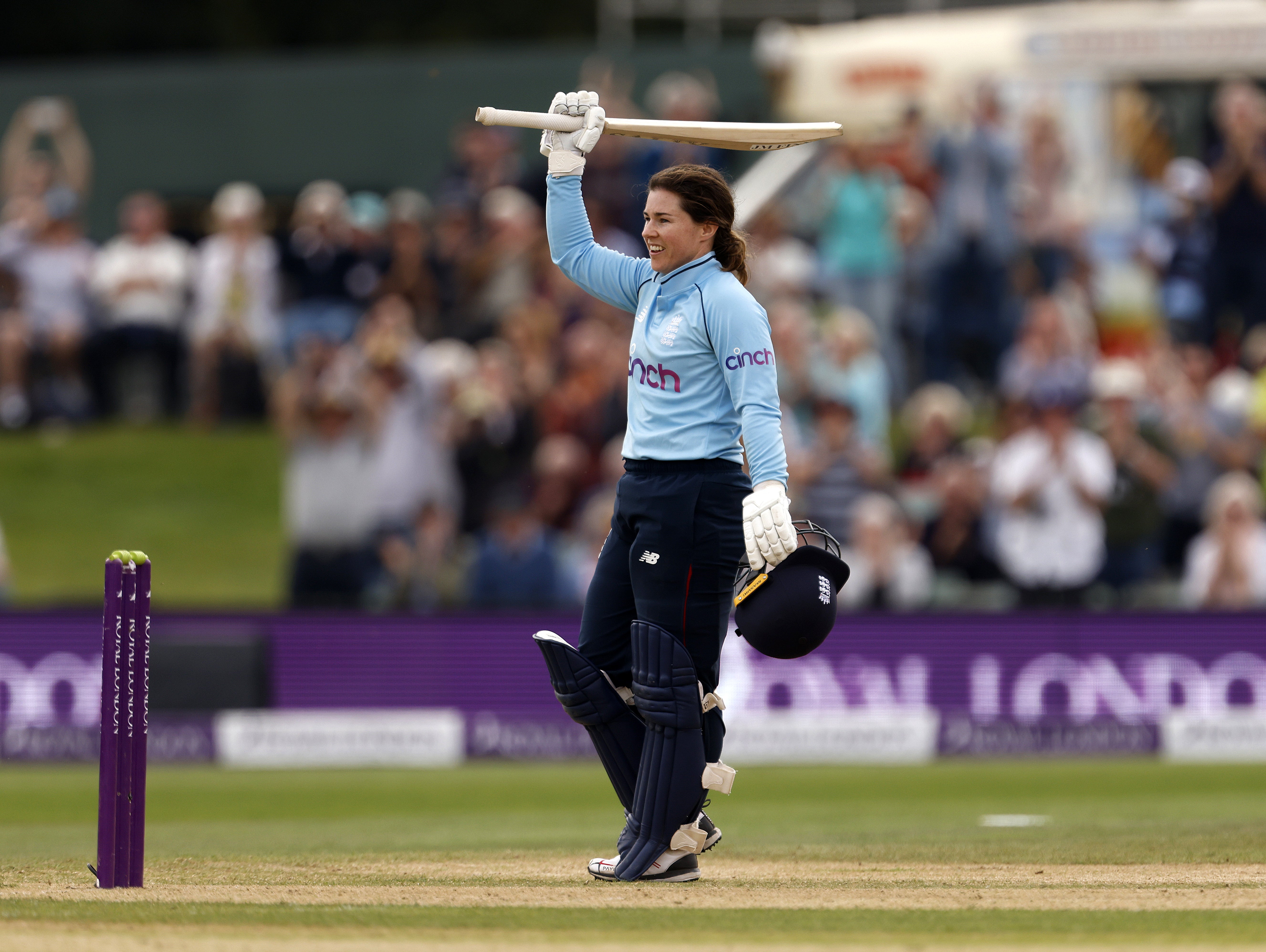 England’s Tammy Beaumont raises her bat after scoring a century in the one-day international against New Zealand at Canterbury (Steven Paston/PA)