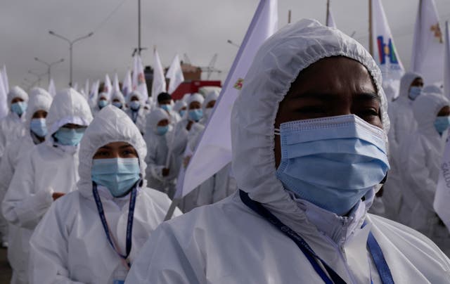 <p>File: Healthcare workers take part in a ceremony kicking off a door-to-door Covid-19 vaccination campaign in El Alto, Bolivia on 16 September 2021</p>