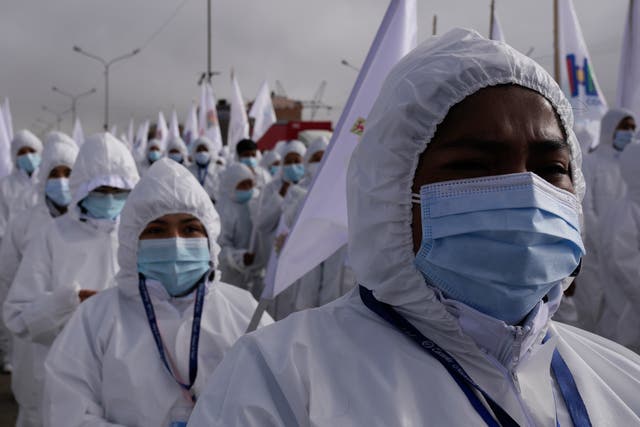 <p>File: Healthcare workers take part in a ceremony kicking off a door-to-door Covid-19 vaccination campaign in El Alto, Bolivia on 16 September 2021</p>