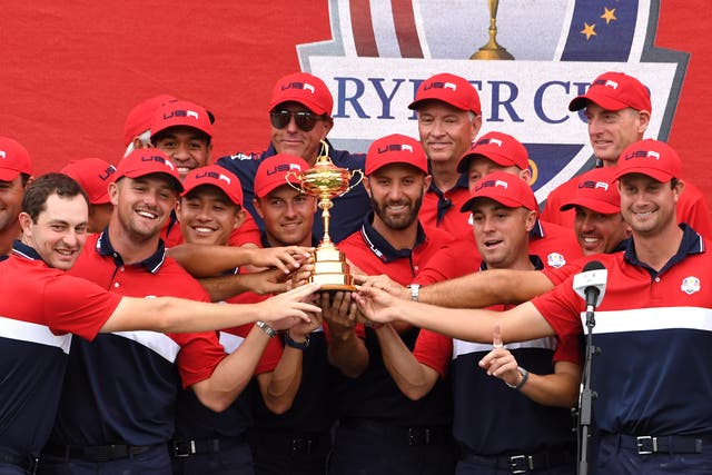 Team USA team celebrate with the Ryder Cup trophy after victory against Team Europe at Whistling Straits (Anthony Behar/PA)