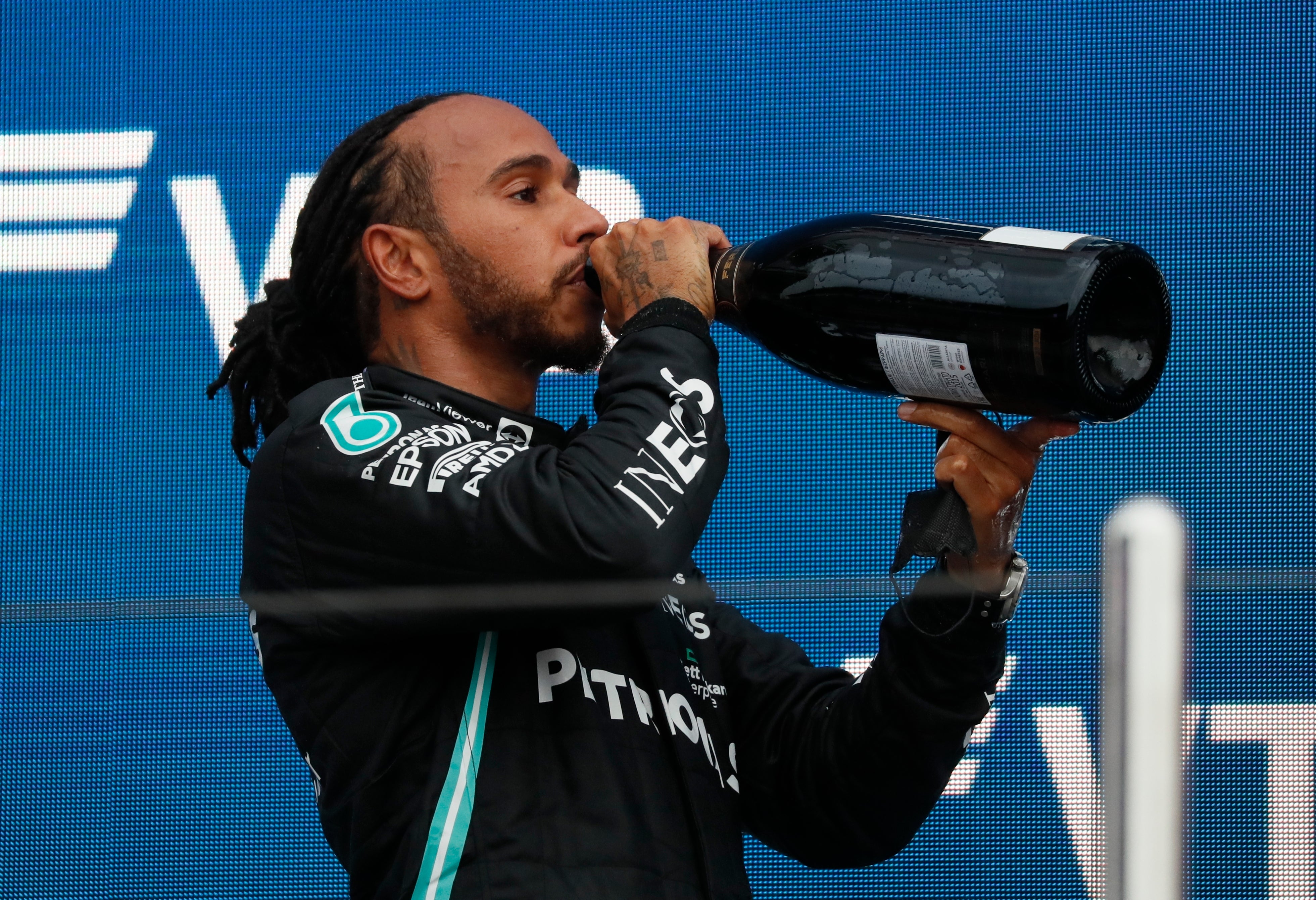 Lewis Hamilton toasts his 100th grand prix win (Yuri Kochetkov/AP)