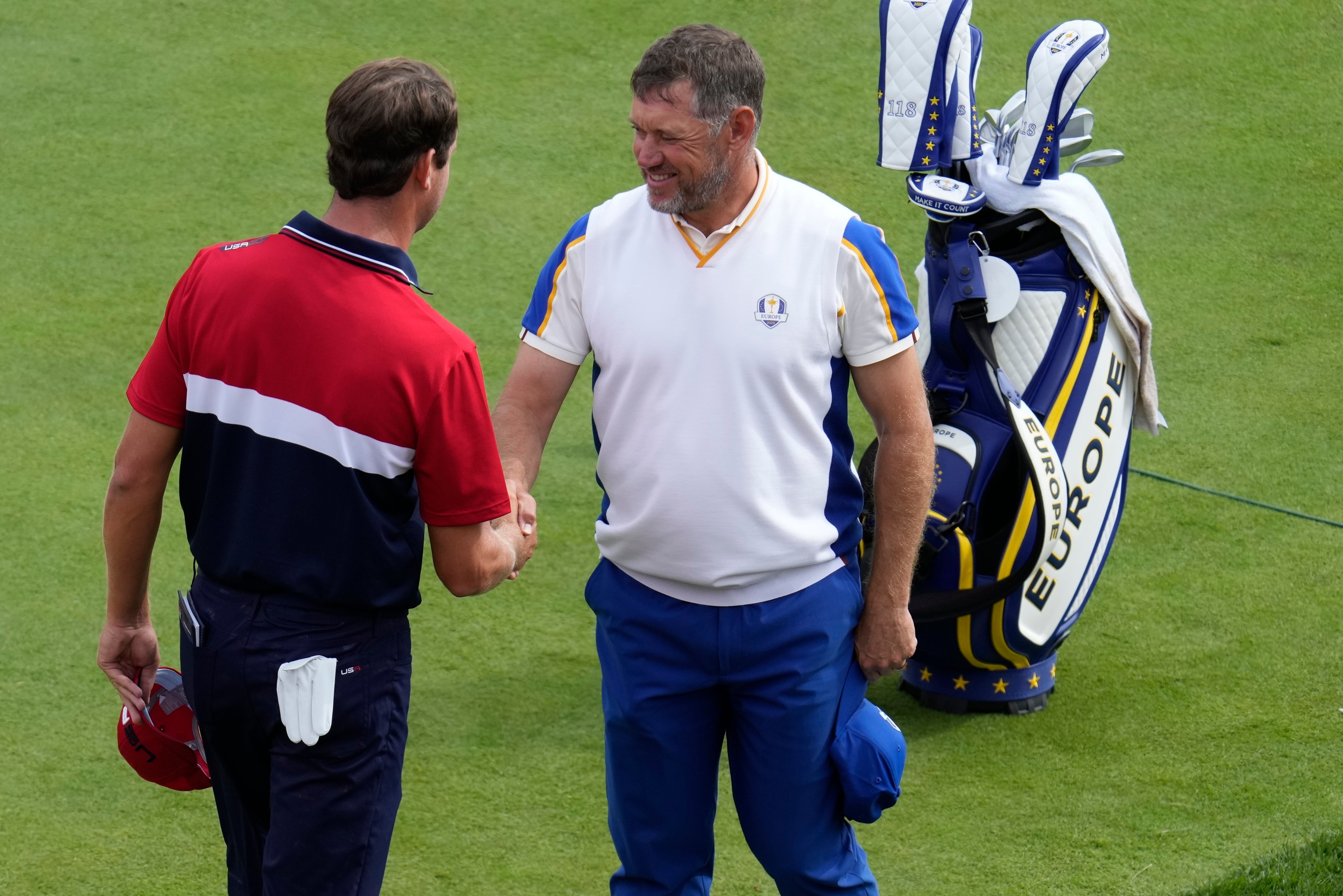 Lee Westwood shakes hands with Harris English after their singles match in the Ryder Cup (Ashley Landis/AP)