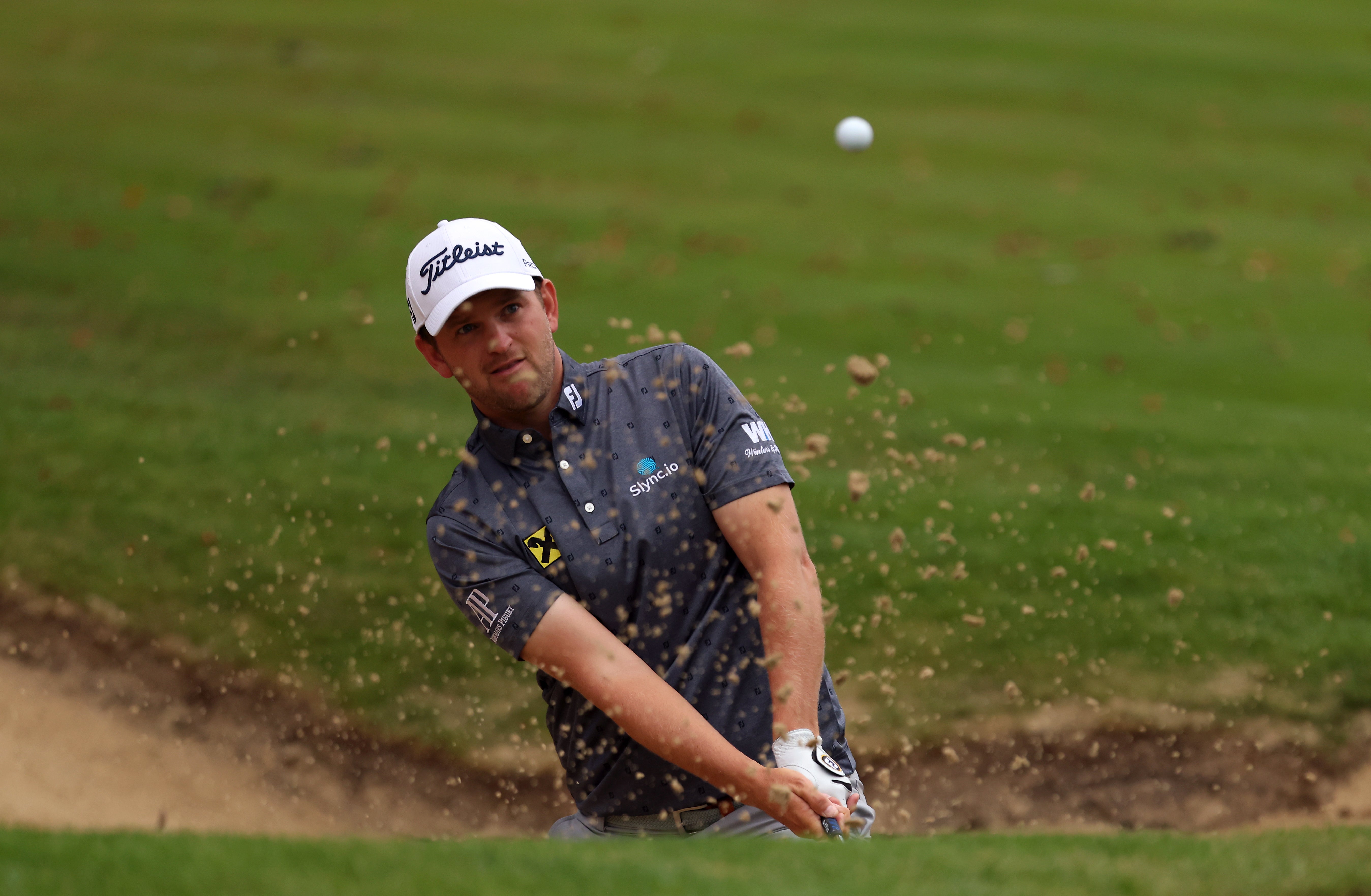 Bernd Wiesberger chips out of a bunker on the 18th during day two of the BMW PGA Championship at Wentworth (Steven Paston/PA)