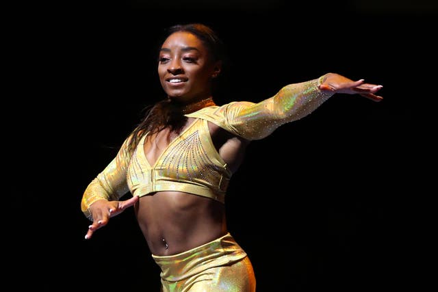 <p>Simone Biles performs during the Gold Over America Tour at Staples Center on 25 September in Los Angeles, California</p>