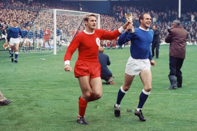 <p>Hunt (left) holds the World Cup with Ray Wilson before the Charity Shield match at Goodison Park in August 1966 </p>