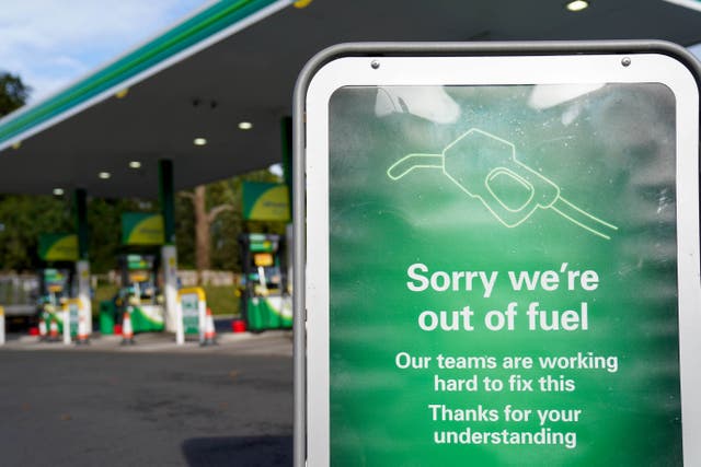 <p>A sign at a  BP petrol station in Birmingham informs drivers that it is out of fuel. </p>