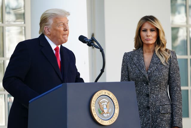 <p>First Lady Melania Trump watches as US President Donald Trump speaks during the annual Thanksgiving turkey pardon in the Rose Garden of the White House in Washington, DC on November 24, 2020</p>