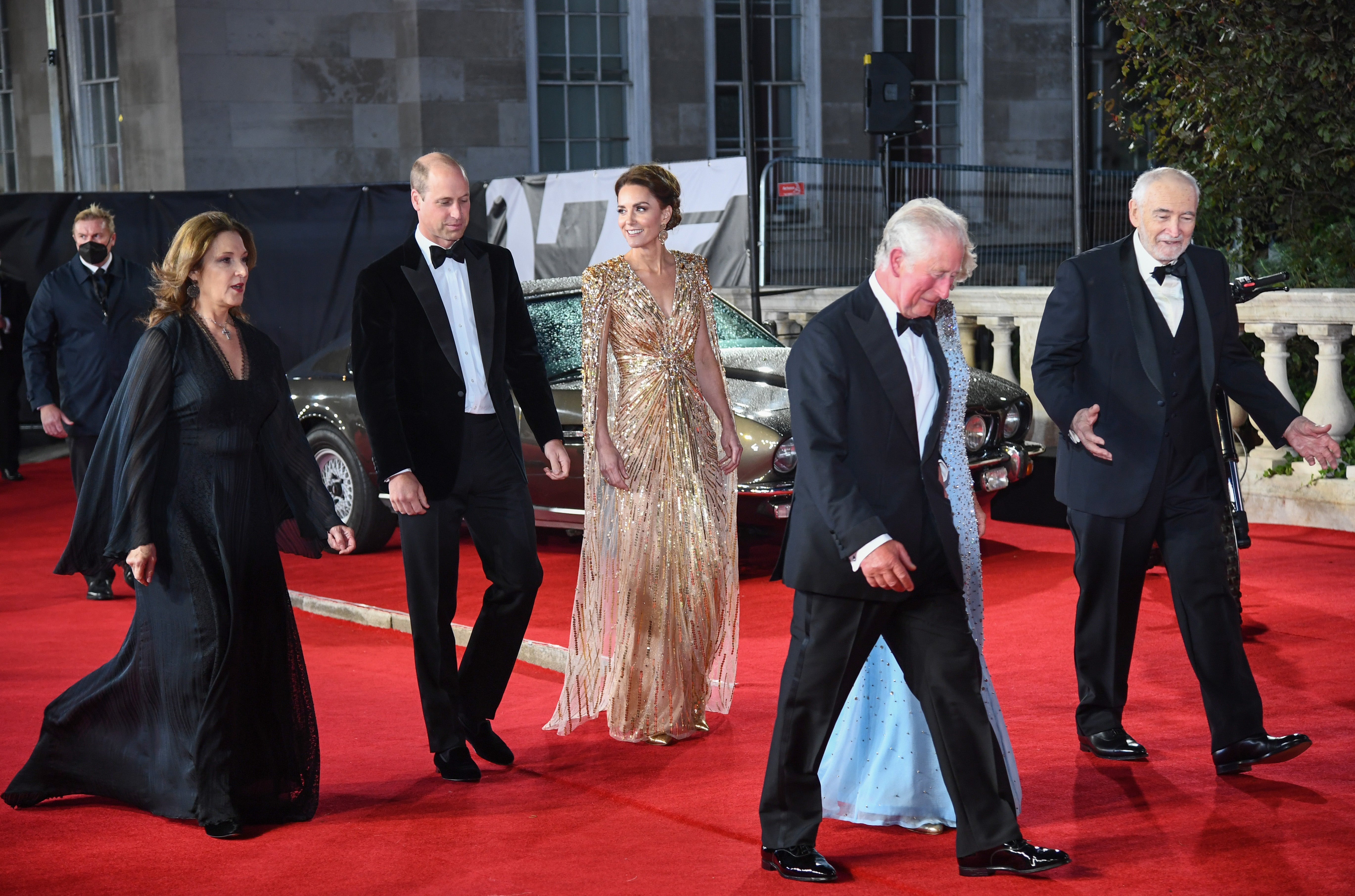 Barbara Broccoli, the Duke and Duchess of Cambridge, Prince Charles, the Duchess of Cornwall, and Michael G Wilson