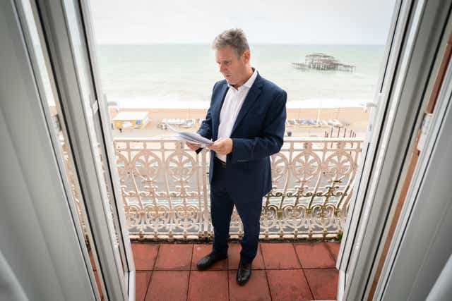 <p>Sir Keir Starmer prepares his Labour Party conference speech in his hotel room in Brighton yesterday </p>