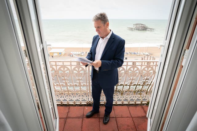 <p>Sir Keir Starmer prepares his Labour Party conference speech in his hotel room in Brighton yesterday </p>