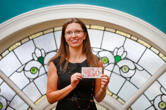 Sarah John, chief cashier of the Bank of England, with a new £50 banknote in June 2021 (Hollie Adams/PA)