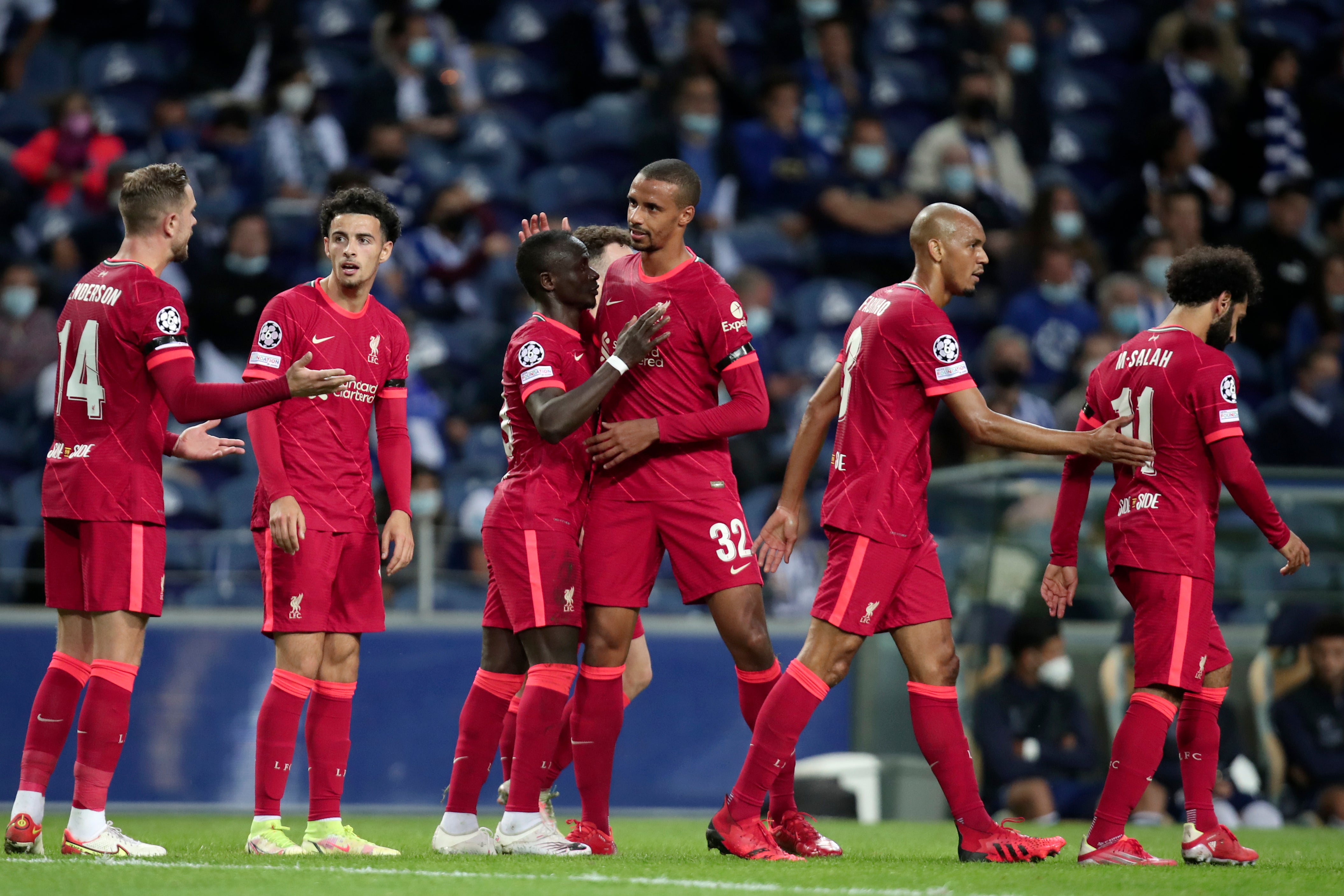 Liverpool celebrated scoring five goals at Porto on Tuesday night (Luis Vieira/AP)