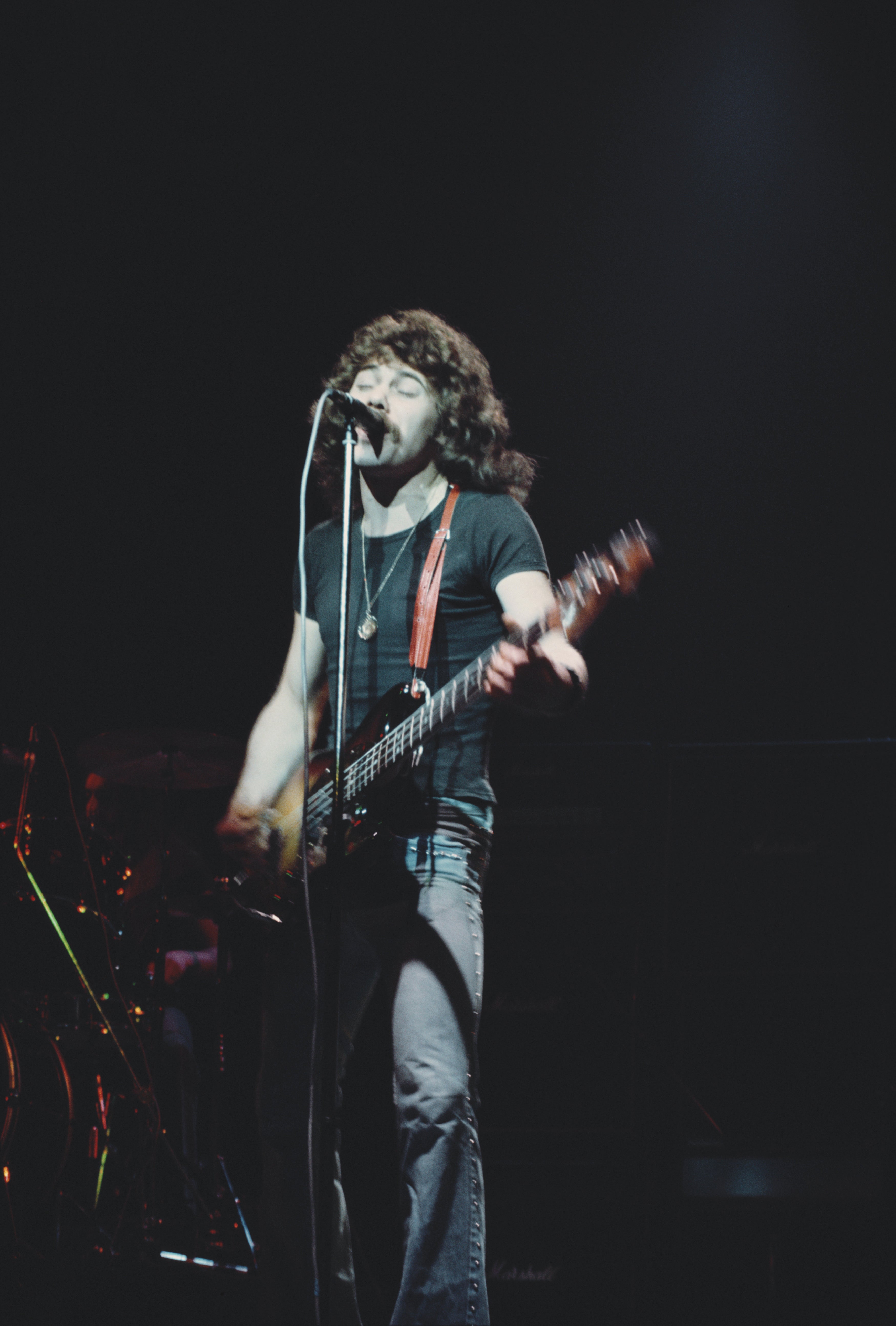 Lancaster performing at the Hammersmith Odeon in 1976