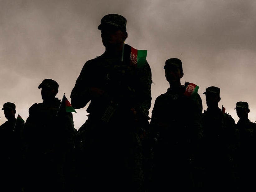 Afghan security forces parade at a base in Kabul in April, just months before the Taliban took over the country