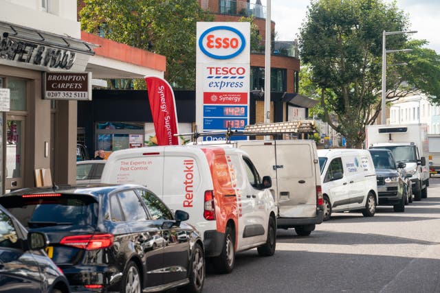 Vehicles queue for fuel at a petrol station in west London (Dominic Lipinski/PA)