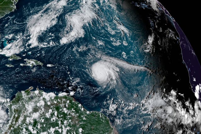 <p>This satellite image provided by the National Oceanic and Atmospheric Administration shows Hurricane Sam, just right of center, in the Atlantic Ocean, Monday, Sept. 27, 2021</p>
