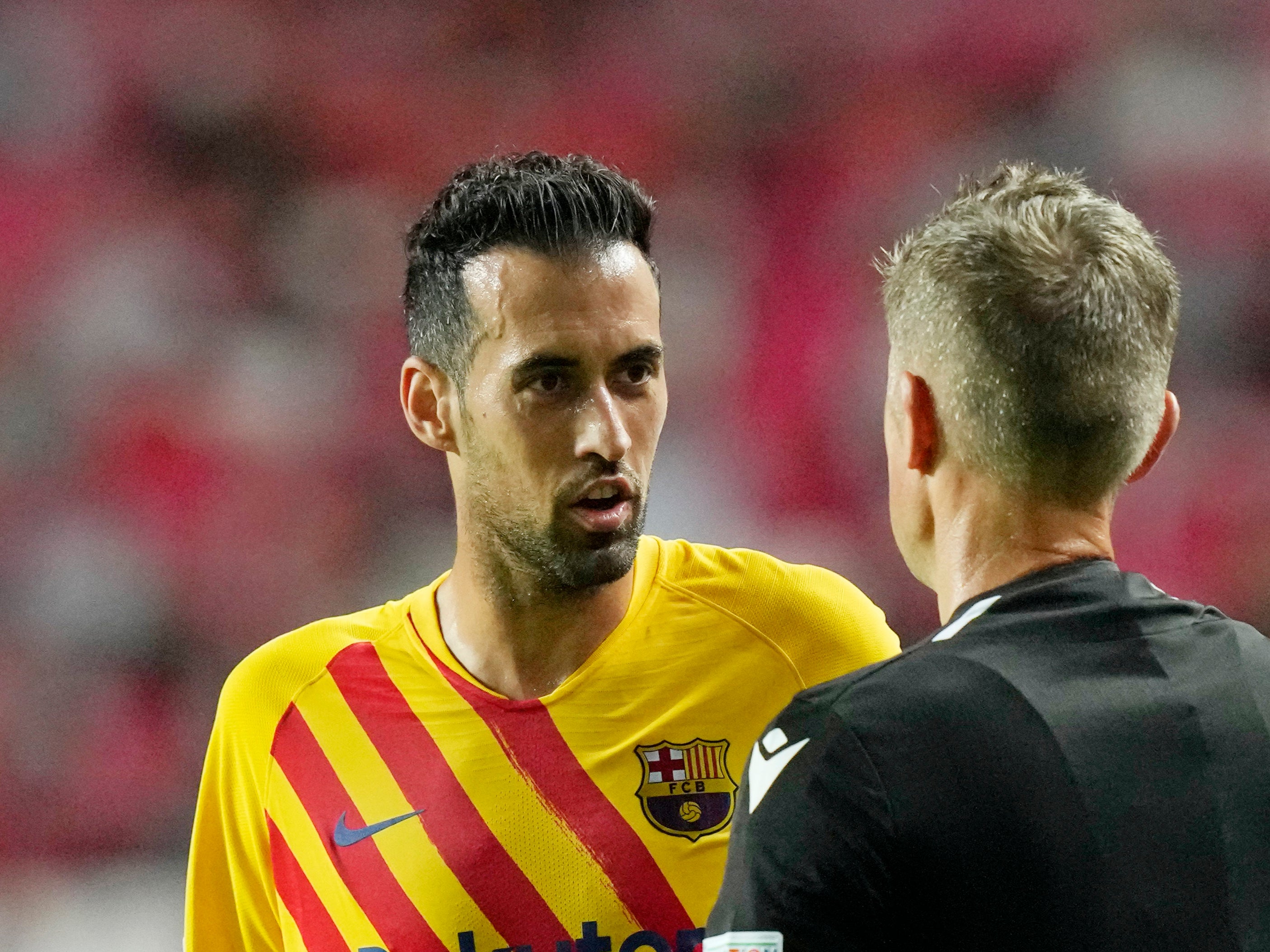 Sergio Busquets speaks with the referee
