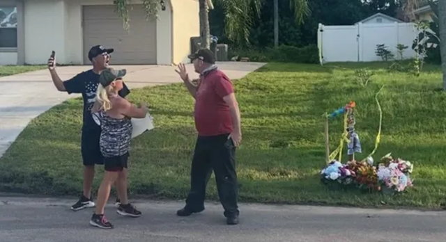 <p>A Laundrie neighbour confronts a protester on Wednesday evening</p>
