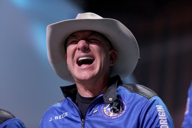 <p>Jeff Bezos laughs as he speaks about his flight on Blue Origin’s New Shepard into space during a press conference on July 20, 2021 in Van Horn, Texas.</p>