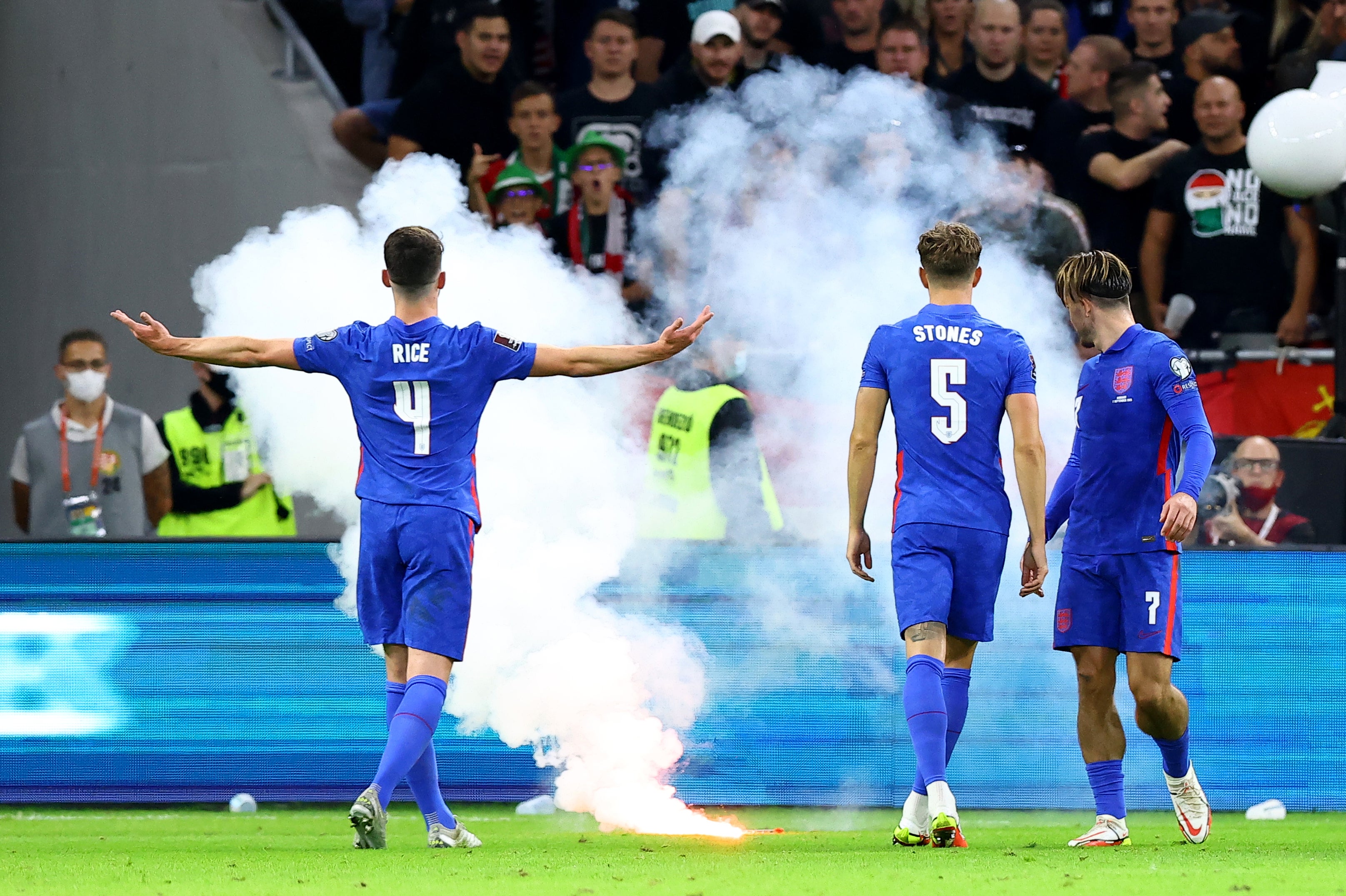 England’s Declan Rice gestures towards the fans as a flare is thrown onto the pitch in Budapest (Attila Trenka/PA)