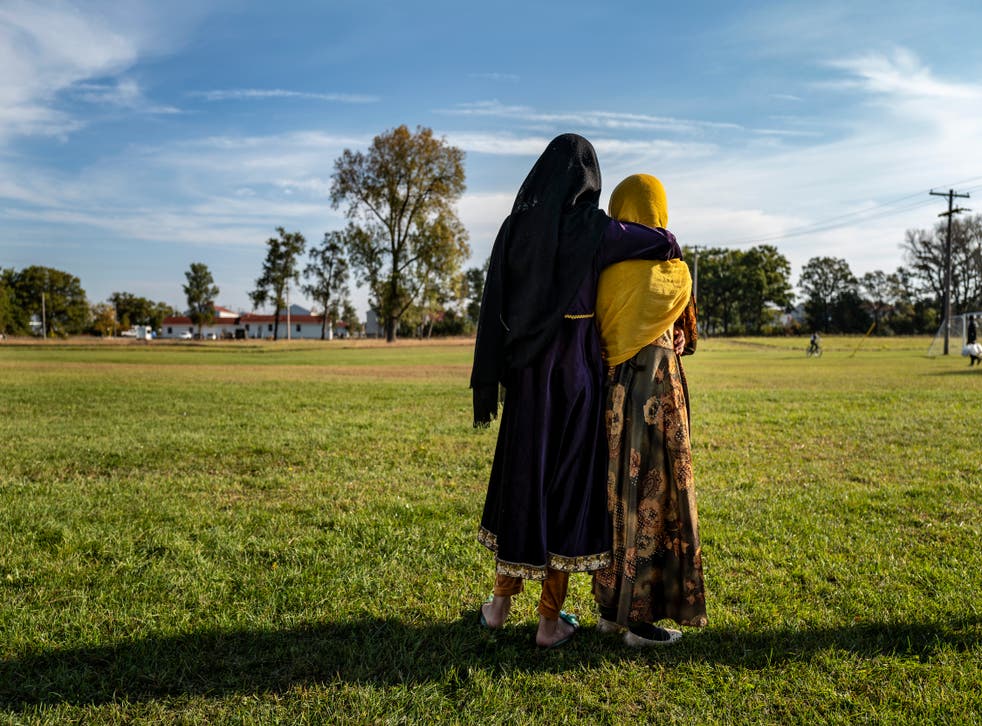 <p>Afghan refugee girls watch football game at an army base in Wisconsin  </p>
