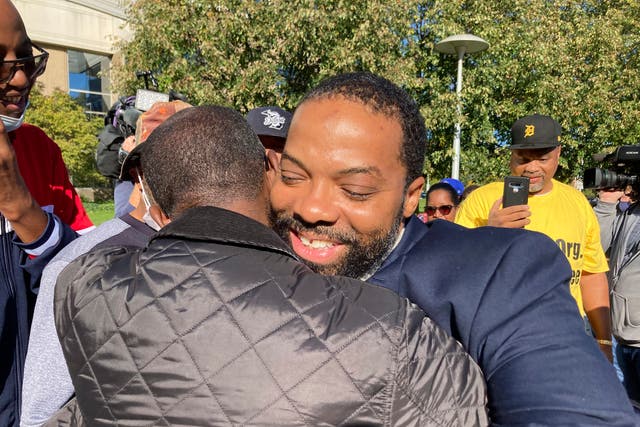 <p>Juwan Deering gets a hug outside the courthouse in Pontiac, Michigan, on Thursday, Sept. 30, 2021, after murder charges were dropped in a fire that killed five children in suburban Detroit in 2000. </p>