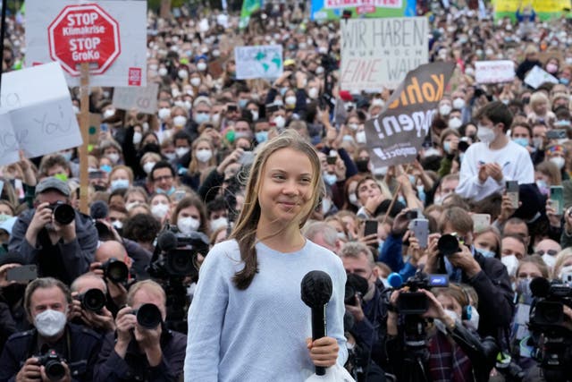 <p>Swedish climate activist Greta Thunberg stands onstage during a Fridays for Future global climate strike in Berlin</p>