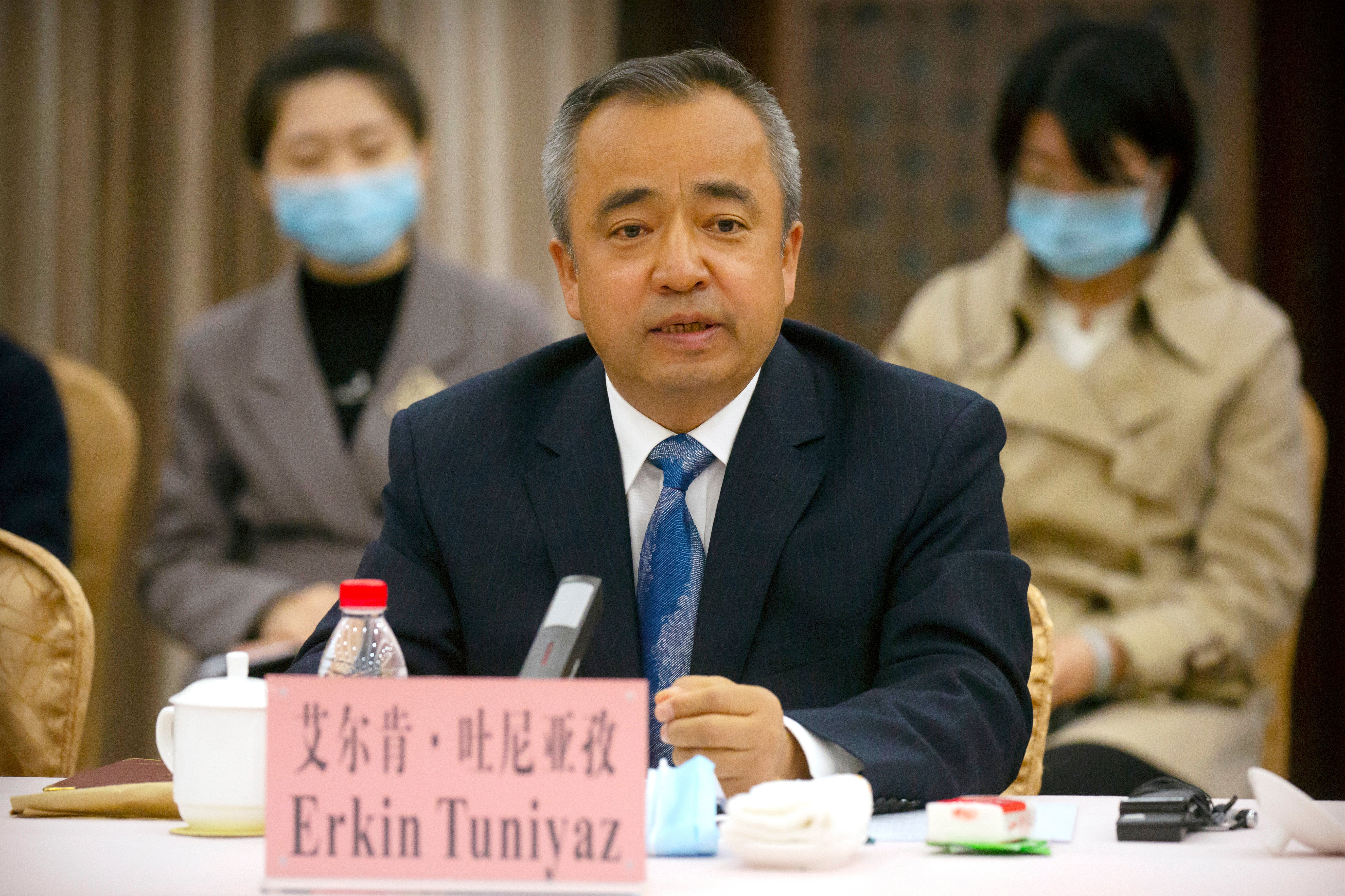 File: Erkin Tuniyaz speaks during a press conference in Urumqi in northwestern China's Xinjiang Uyghur region