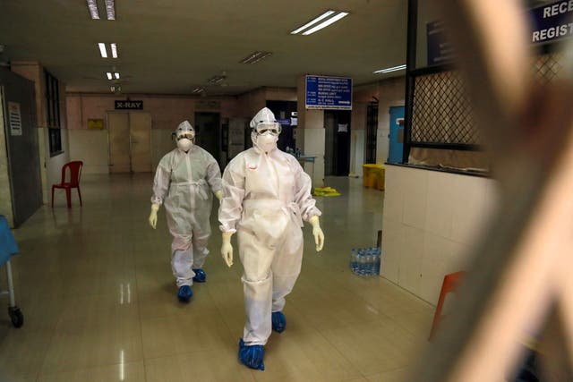 <p>File. Health officials in full protective gear walk inside an isolation ward in October 2021 in the Indian state of Kerala after 23-year-old was infected by the potentially deadly Nipah virus</p>