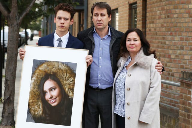 <p>Nadim and Tanya Ednan-Laperouse, with their son Alex holding a portrait of Natasha, in 2018</p>