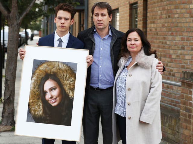 <p>Nadim and Tanya Ednan-Laperouse, with their son Alex holding a portrait of Natasha, in 2018</p>