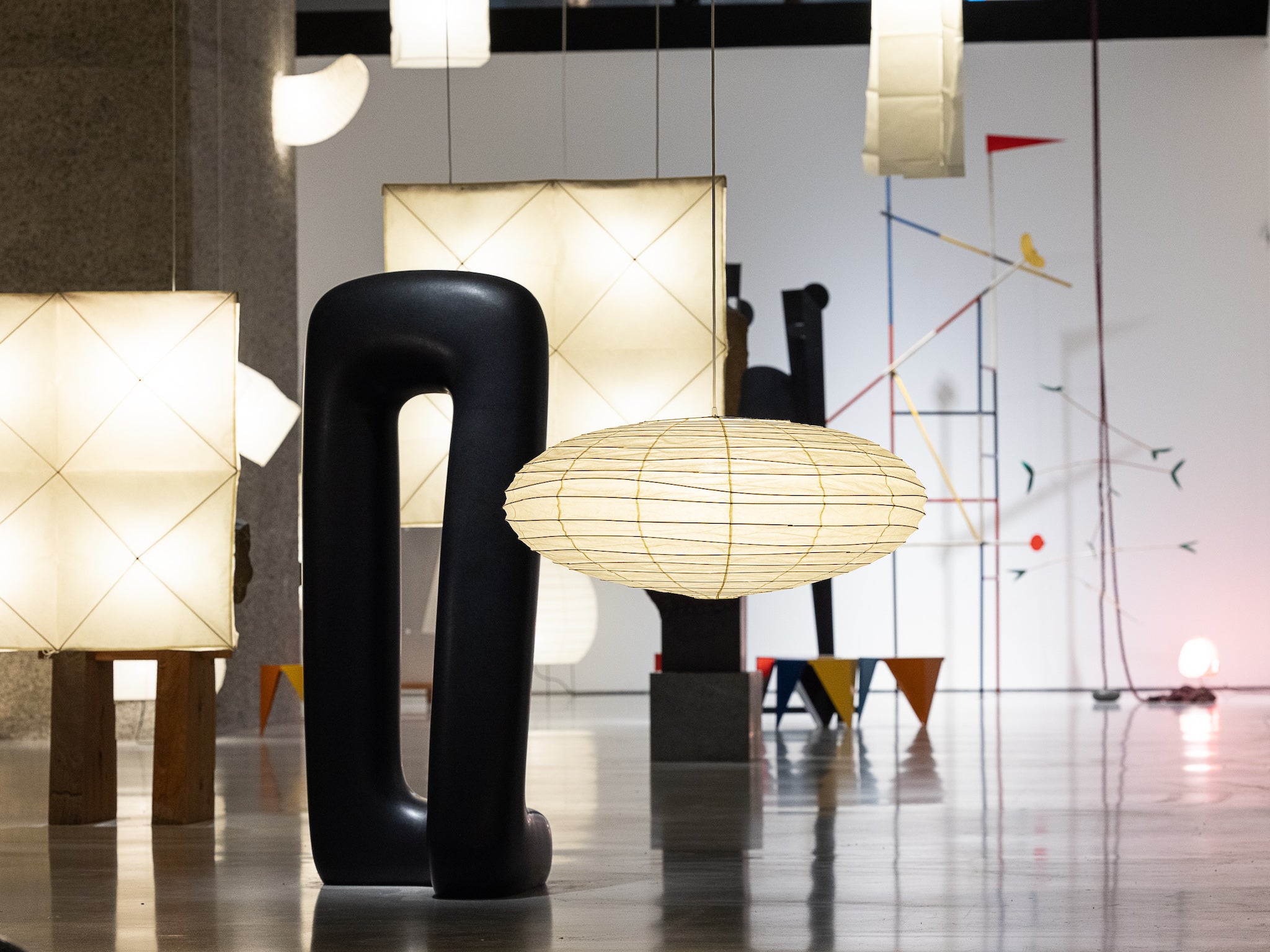 A selection of the 200 versions of the Akari lampshade illuminates the space