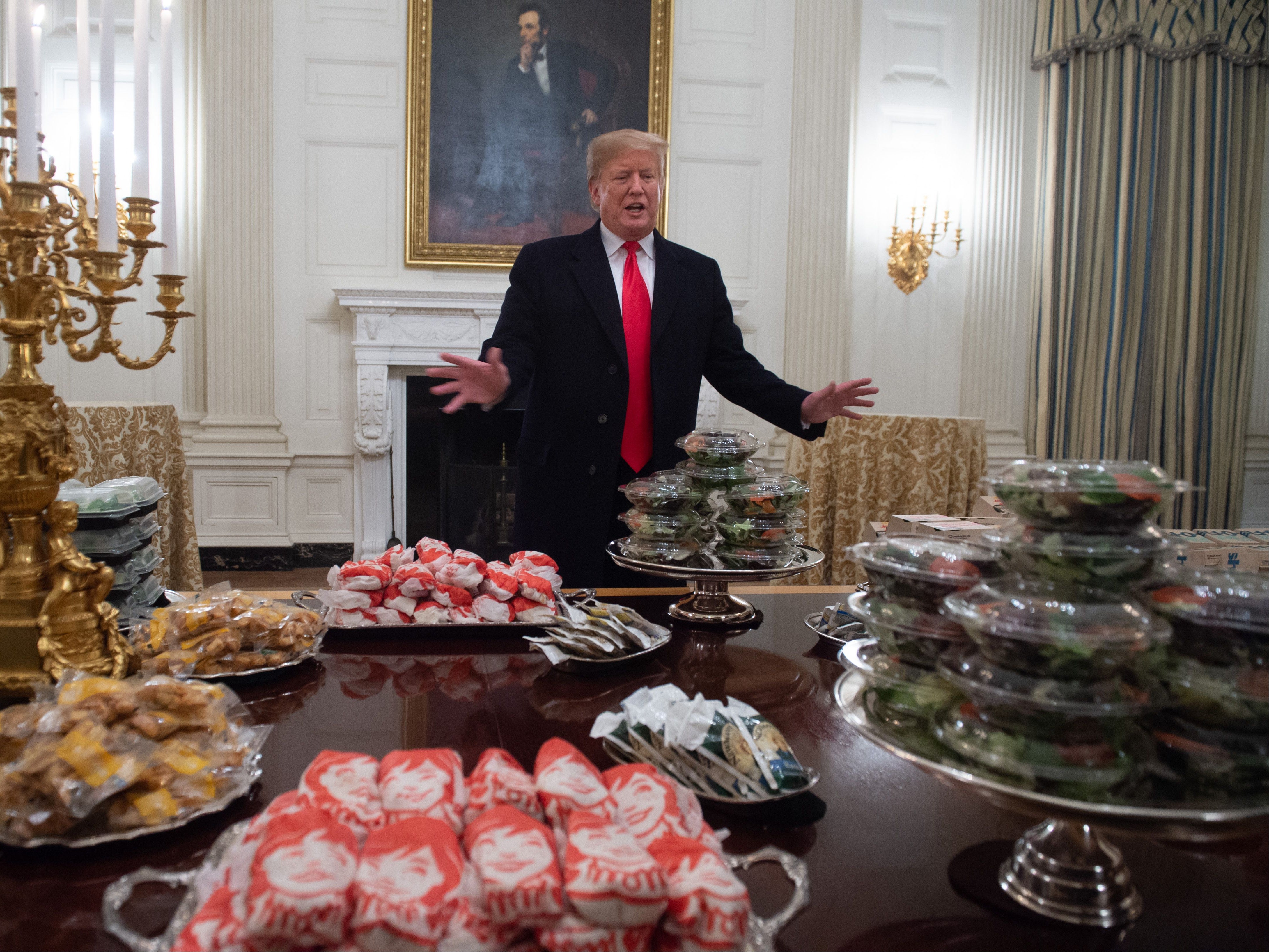 <p>Donald Trump speaks alongside fast food he purchased for a ceremony honouring the 2018 College Football Playoff National Champion Clemson Tigers</p>