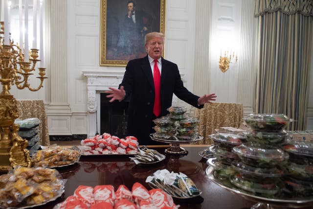 <p>Donald Trump speaks alongside fast food he purchased for a ceremony honouring the 2018 College Football Playoff National Champion Clemson Tigers</p>