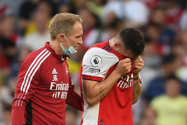 <p>Granit Xhaka (right) reacts after sustaining an injury in Arsenal’s win over Spurs</p>