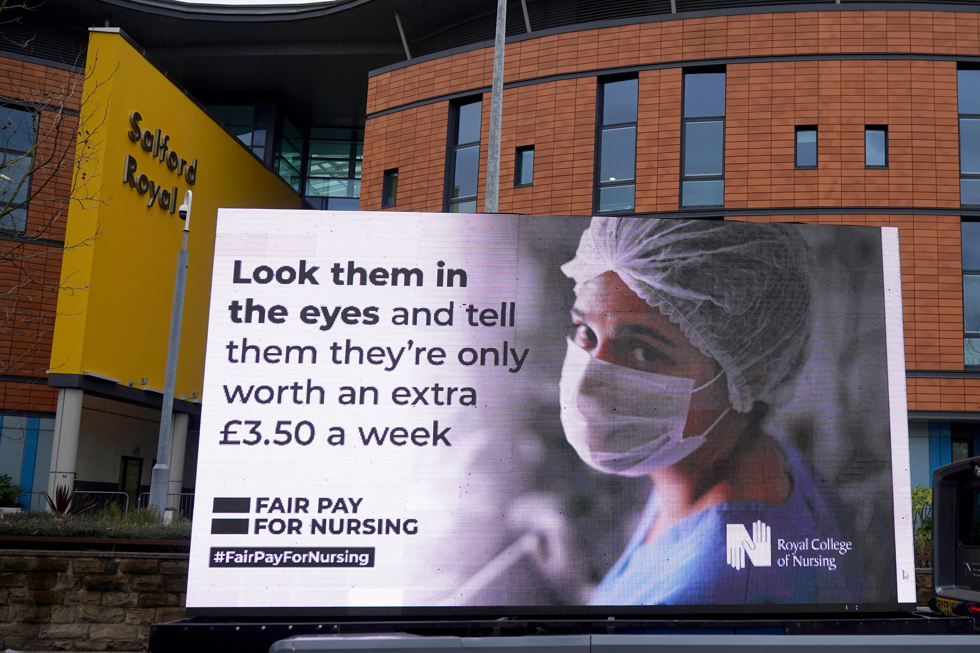 A billboard displays the Royal College of Nursing’s response to the government’s NHS pay proposal in March