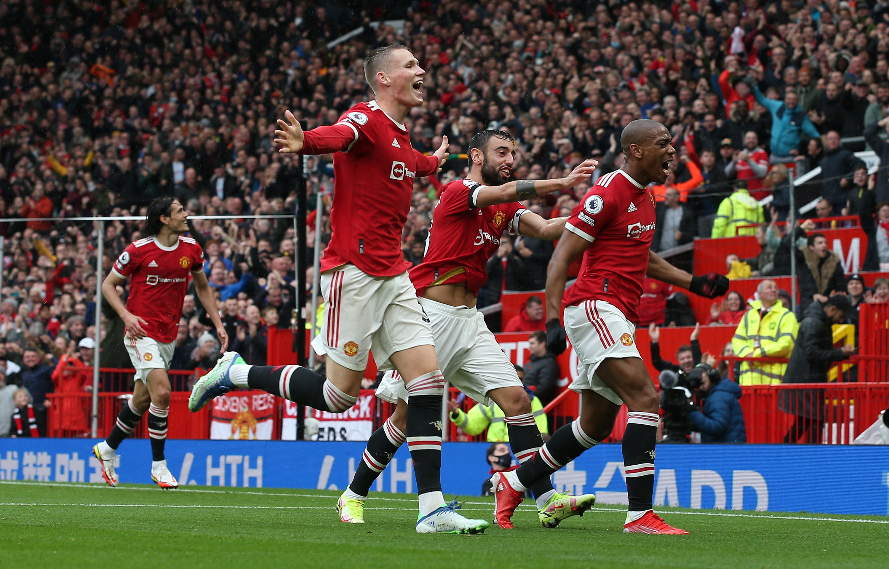 Manchester United celebrate their first-half goal in the Premier League