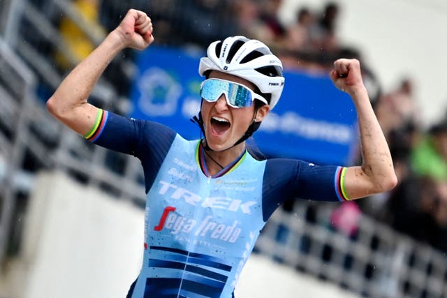 <p>Lizzie Deignan celebrates as she crosses the finish line to win the first edition of the women elite race of the 'Paris-Roubaix' cycling event</p>