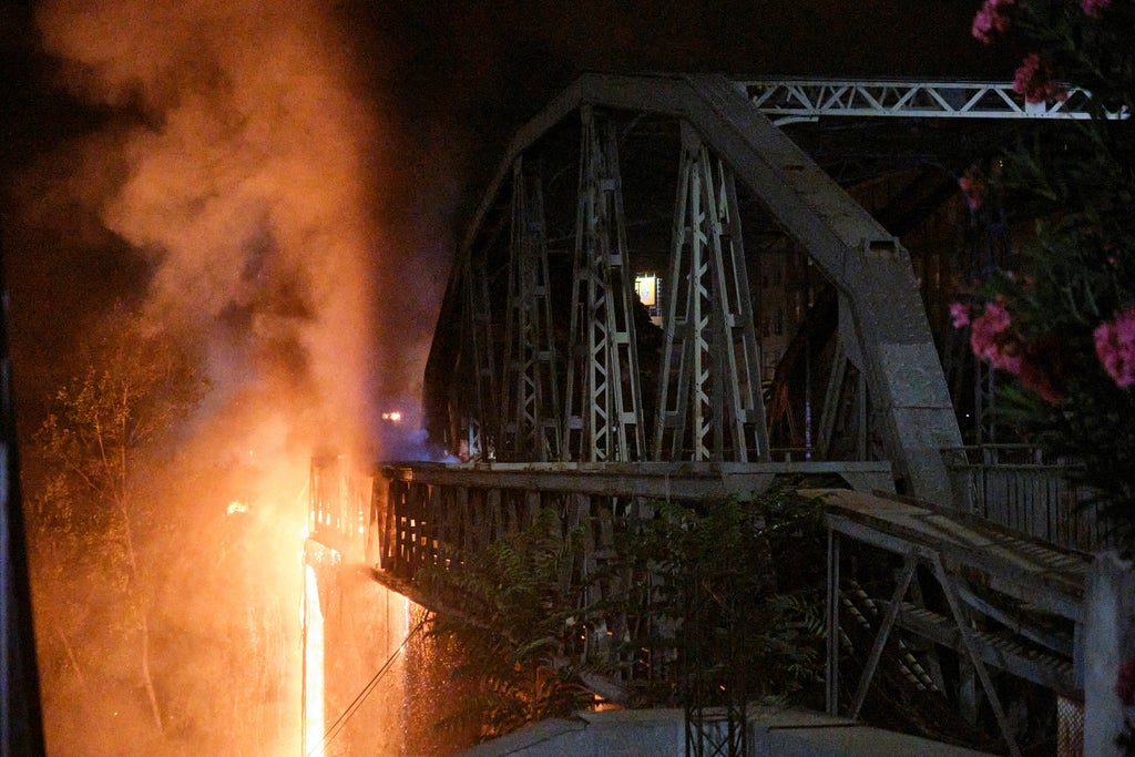 Blaze damages historic bridge spanning Tiber River in Rome