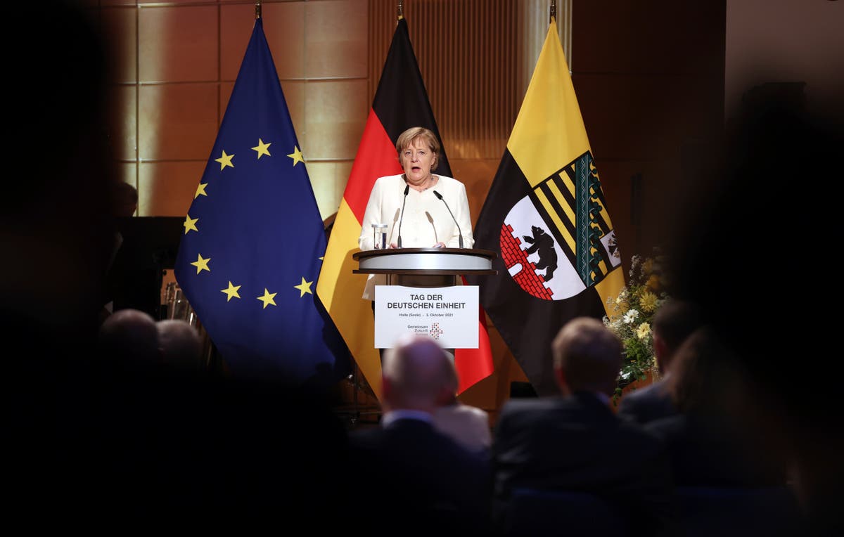 Merkel urges Germans: Keep working for democracy