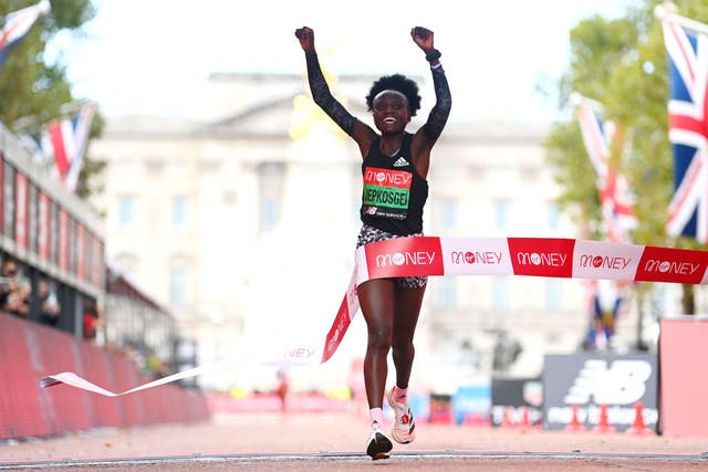 <p>Joyciline Jepkosgei celebrates winning the women’s elite race during the 2021 Virgin Money London Marathon on Sunday </p>