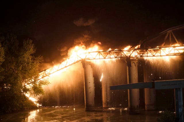 <p>Flames engulf the Industry Bridge in Rome early on Sunday</p>