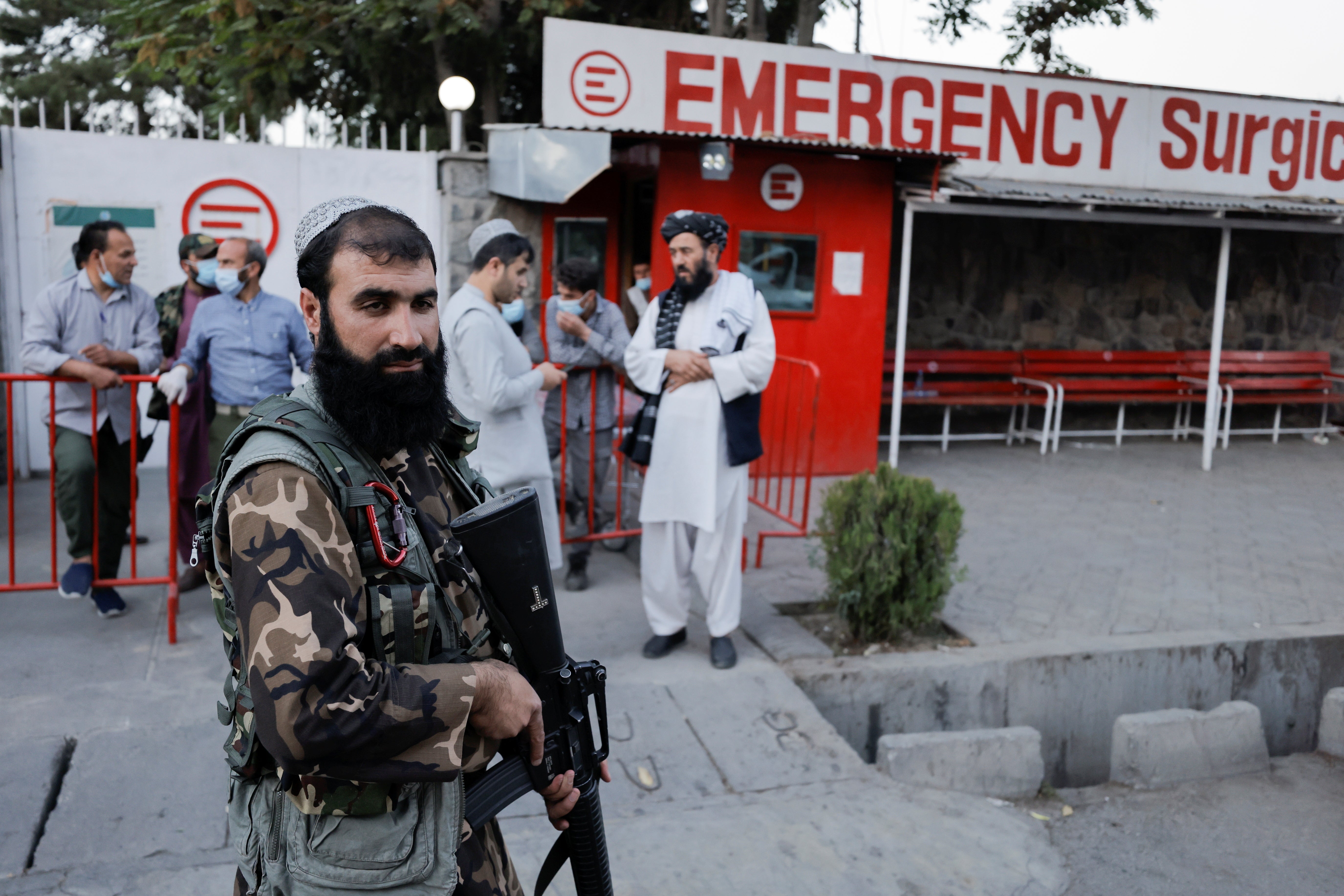 Taliban guard a hospital in Kabul after several civilians were killed in an explosion