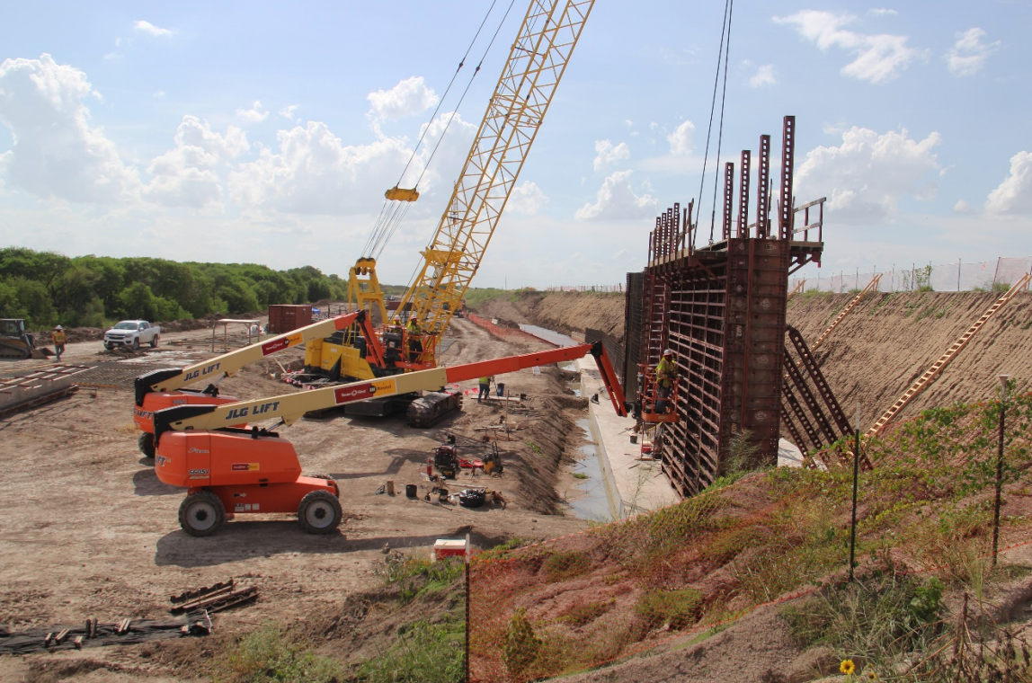 Recent construction converting a flood control levee near Abram, Texas into a ‘levee-border wall’. The slope of the former levee is indicated by the grassy slope on right