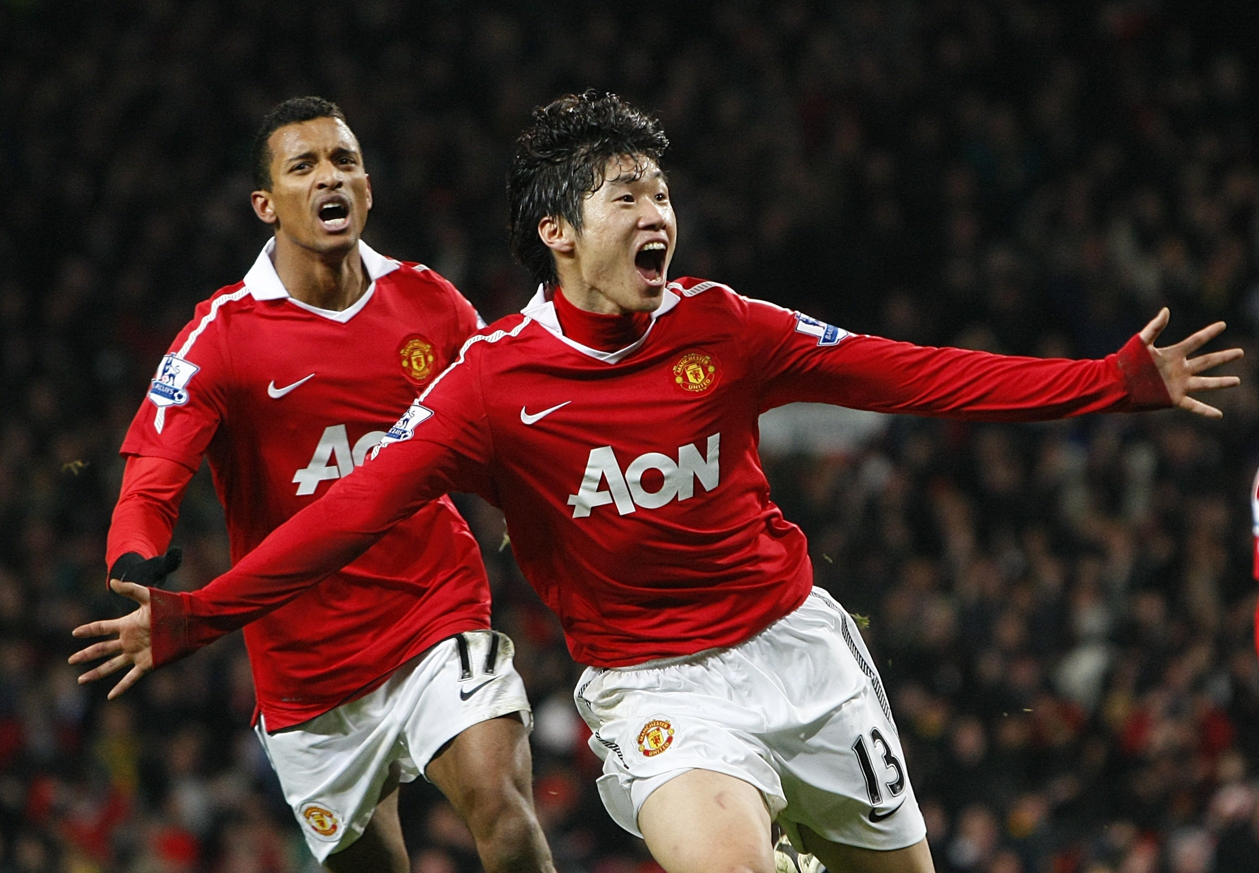 Ji-Sung Park (right) has appealed to Manchester United fans to stop a song which contains a racial stereotype about his native South Korea (Dave Thompson/PA)