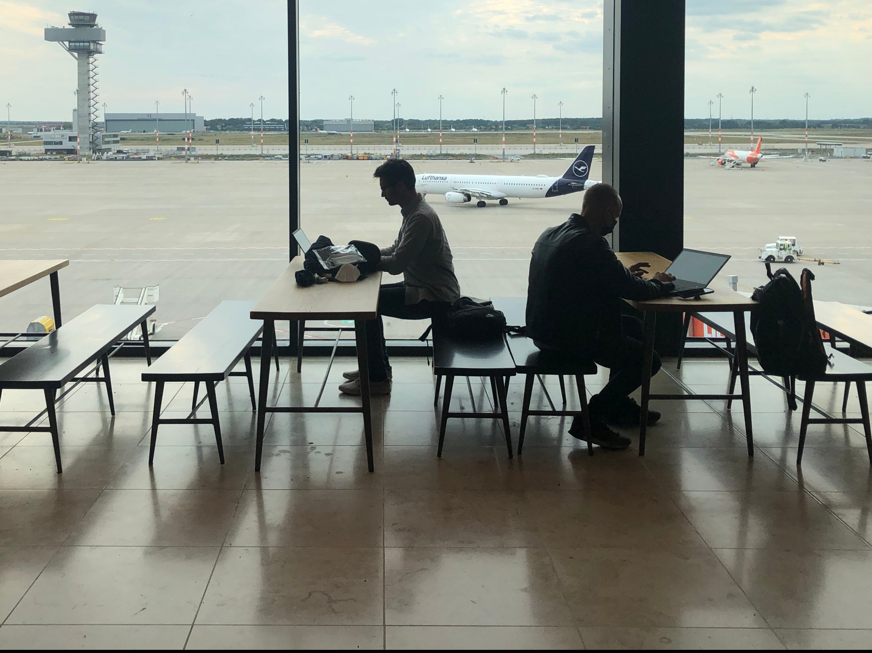 Testing times: Passengers at Berlin airport preparing for a flight to the UK
