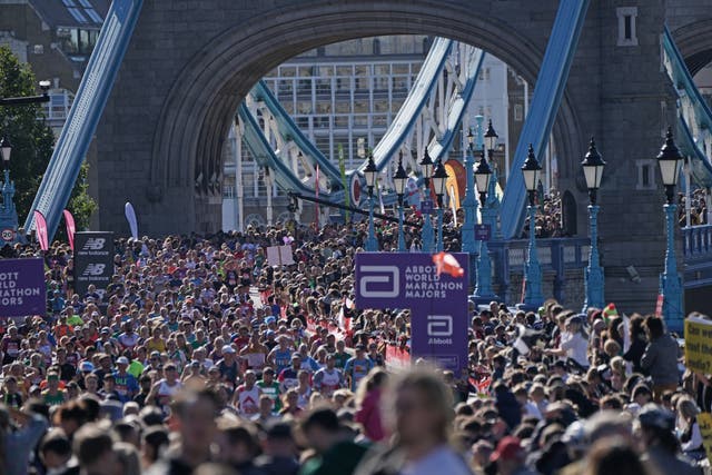 Runners cross Tower Bridge as the full-scale running of the London Marathon returned to the streets of the capital after over a two-year gap (Jonathan Brady/PA)