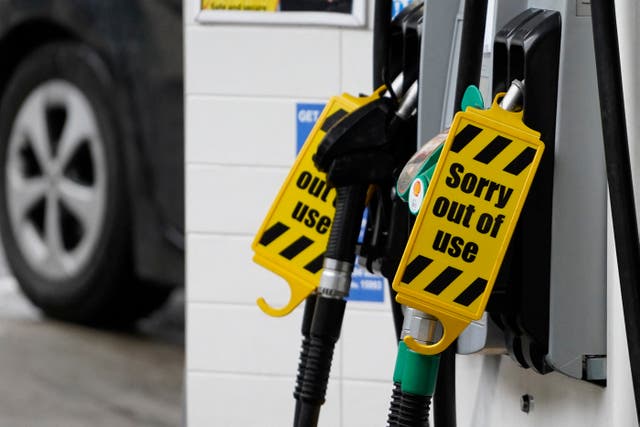 <p>'Out of Use' signs are displayed on the fuel pumps at a filling station in Baker Street, central London, on 2 October 2021</p>