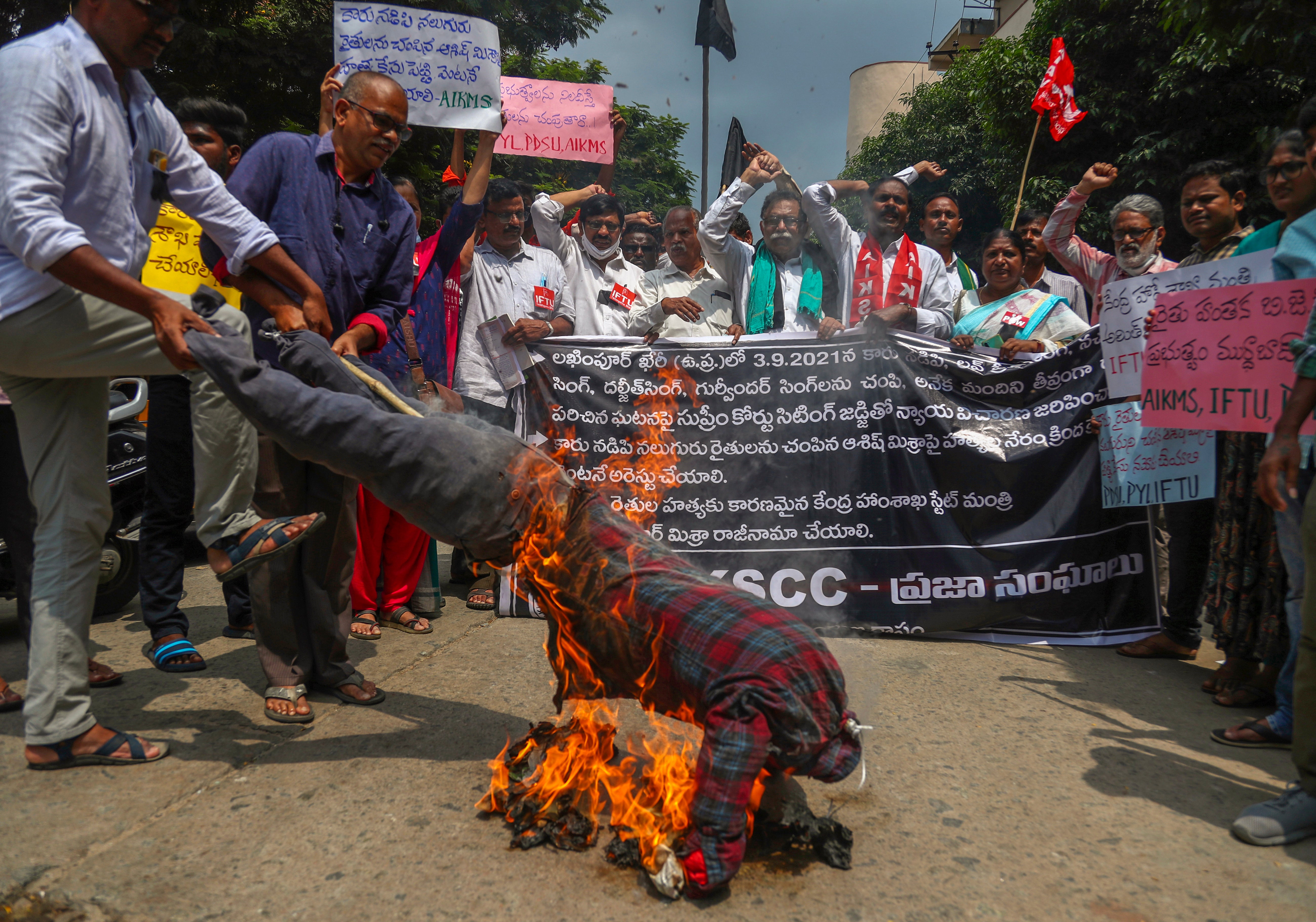 Indian farmers burn effigies on 4 October in Hyderabad to protest against the killing of four farmers in Uttar Pradesh state after being run over by a car owned by India's junior Home Minister Ajay Mishra